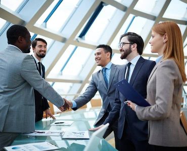 bigstock-Two-businessmen-handshaking-af-66427792