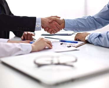 bigstock-Business-meeting-at-the-table-99066275