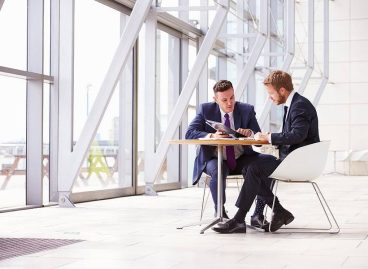 bigstock-Two-business-colleagues-at-mee-101229776-1-1